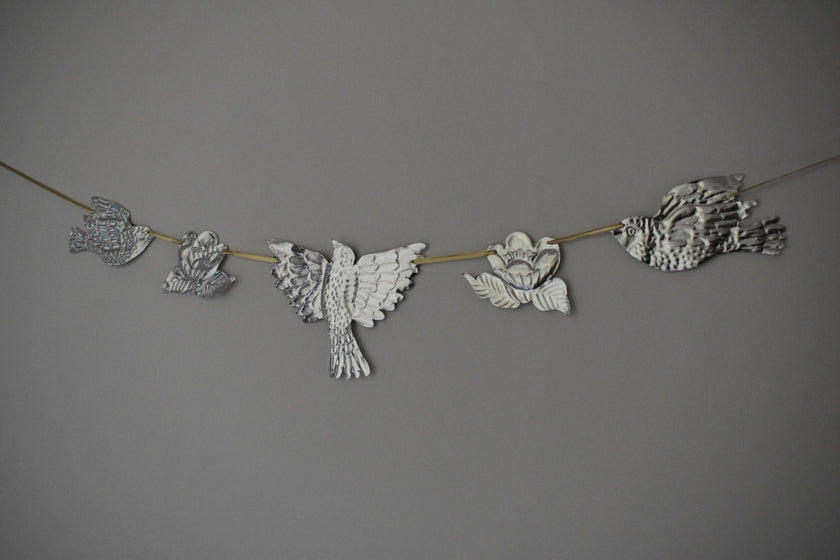 Embossed Tin Bird Garland - hand embossed metal flying bird and flower bunting - folk art tin birds wall banner