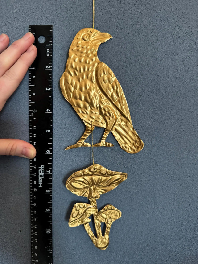 Embossed gold tin Crow and Mushrooms- hand pressed foil hanging decoration