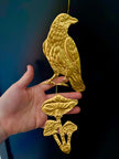 Embossed gold tin Crow and Mushrooms- hand pressed foil hanging decoration